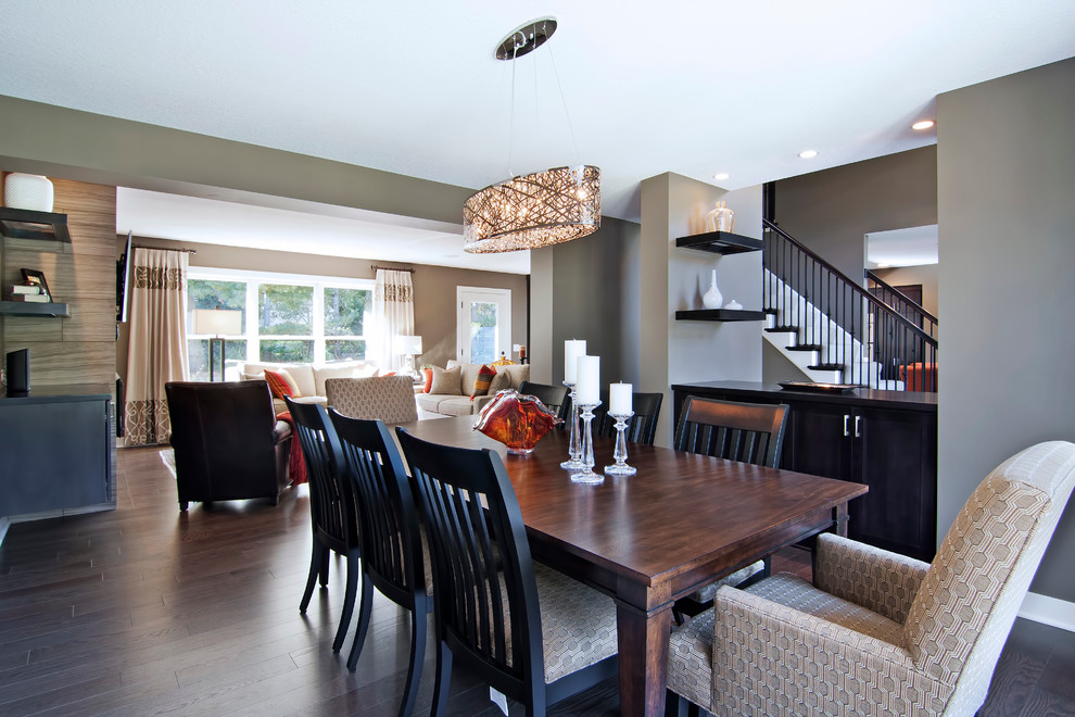 Contemporary dining room in Minneapolis with grey walls.