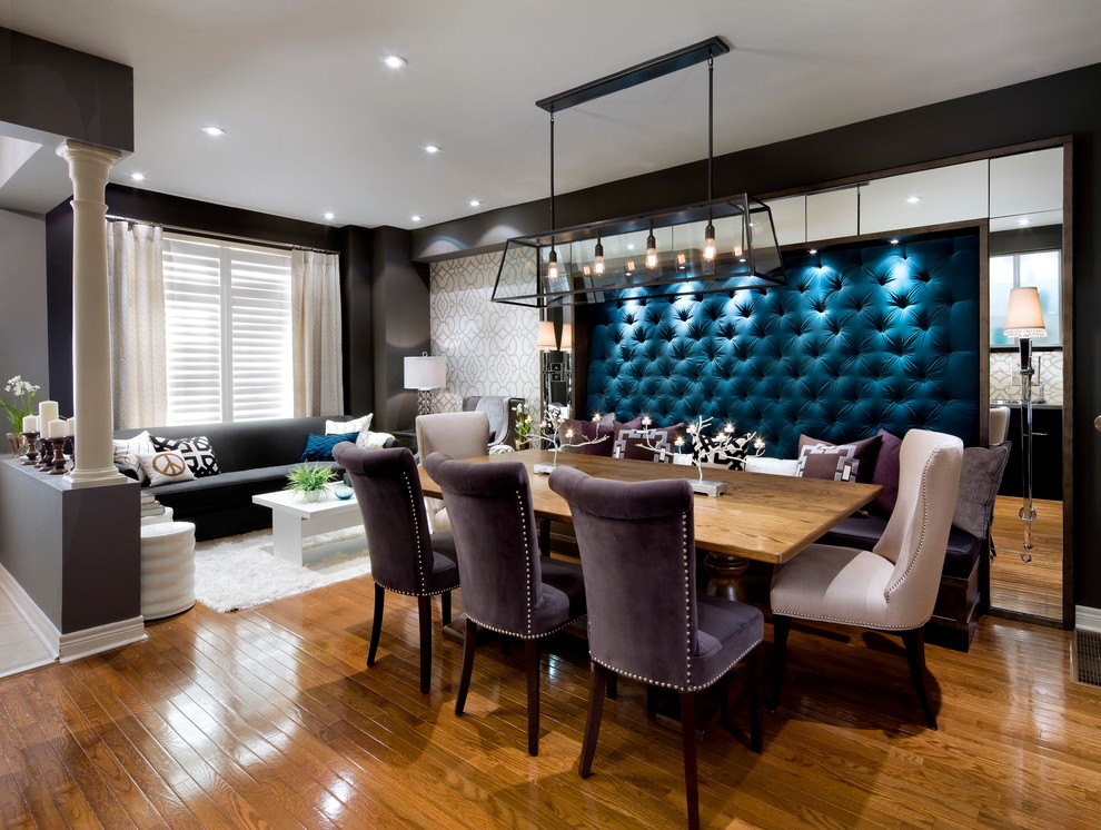 Contemporary dining room in Toronto with medium hardwood flooring and no fireplace.