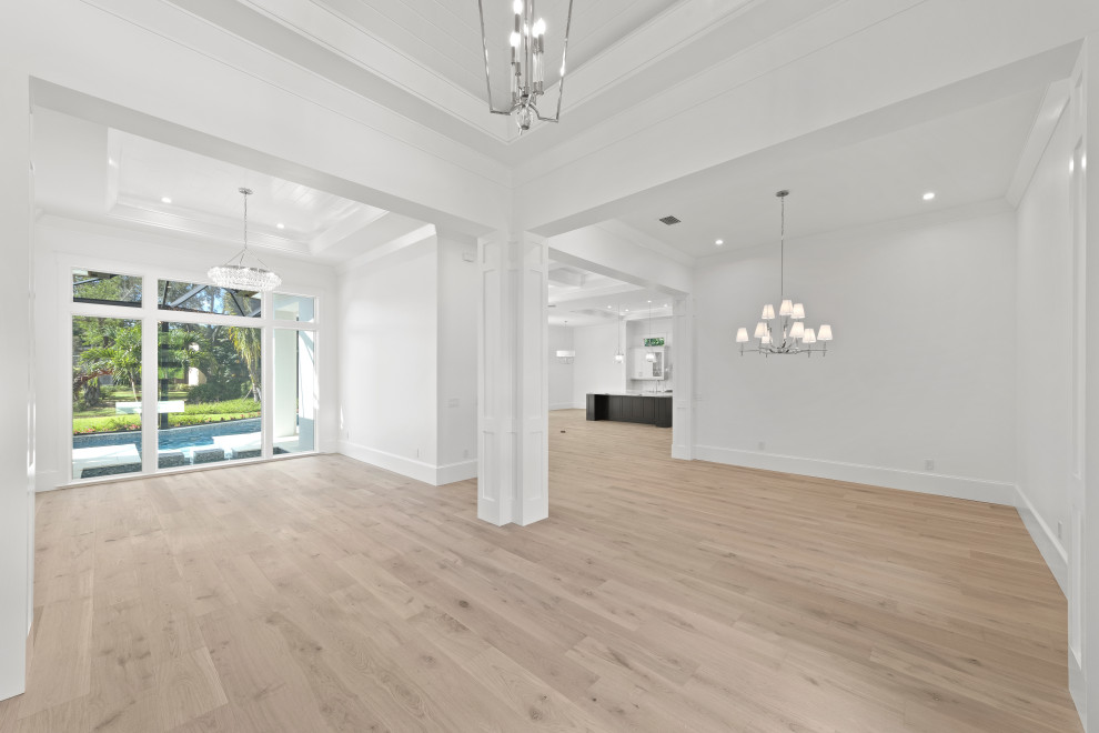 Large transitional light wood floor and beige floor great room photo in Miami with white walls and no fireplace