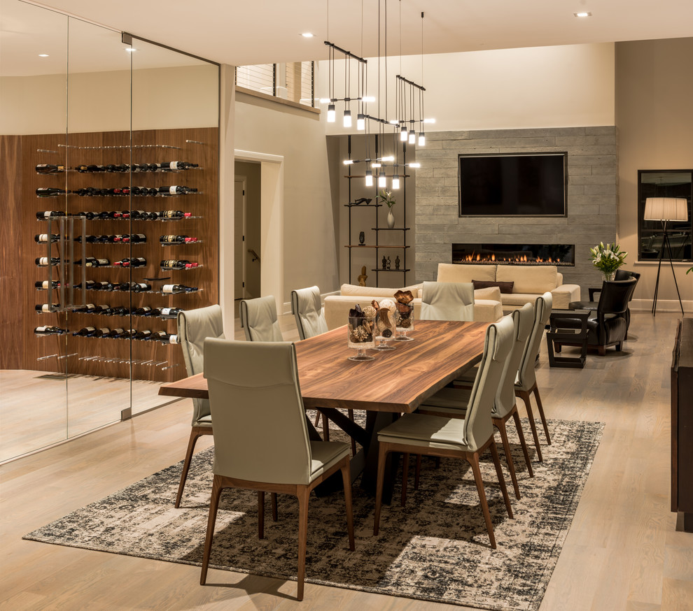 Photo of a large traditional open plan dining room in Philadelphia with light hardwood flooring, beige floors, beige walls and feature lighting.