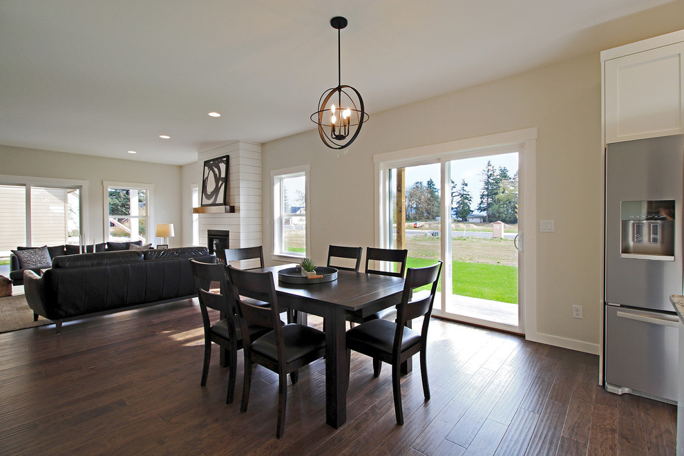 Mid-sized arts and crafts dark wood floor great room photo in Seattle with gray walls and no fireplace