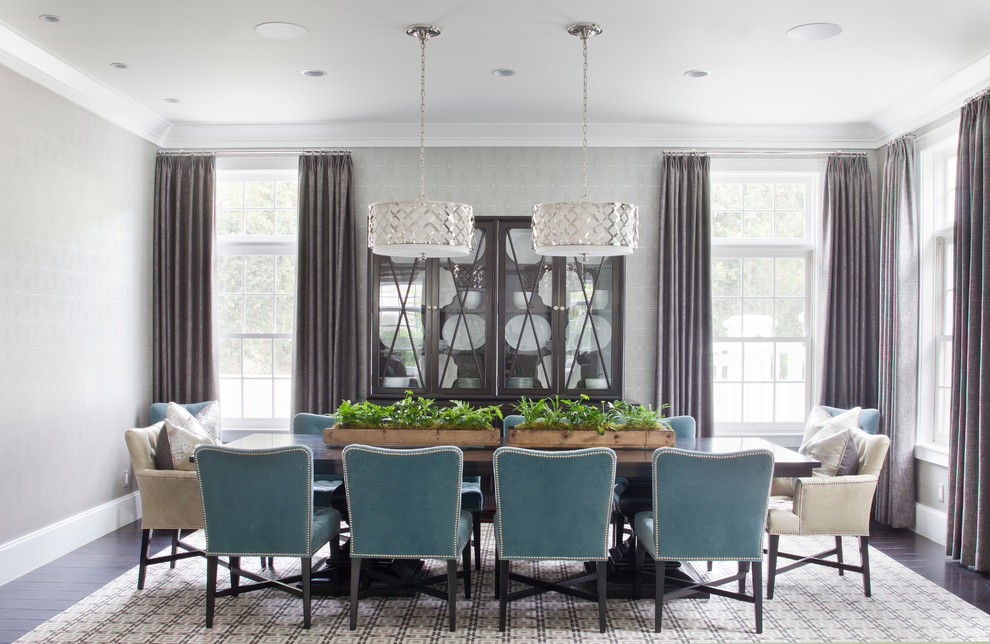 Inspiration for a large classic open plan dining room in Los Angeles with grey walls, dark hardwood flooring, no fireplace and feature lighting.