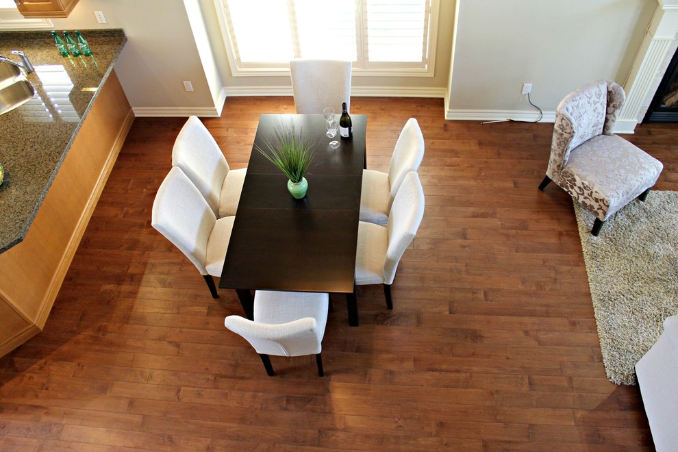 Great room - large contemporary medium tone wood floor great room idea in Toronto with beige walls