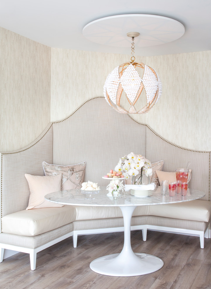 Traditional dining room in Vancouver with beige walls and medium hardwood flooring.