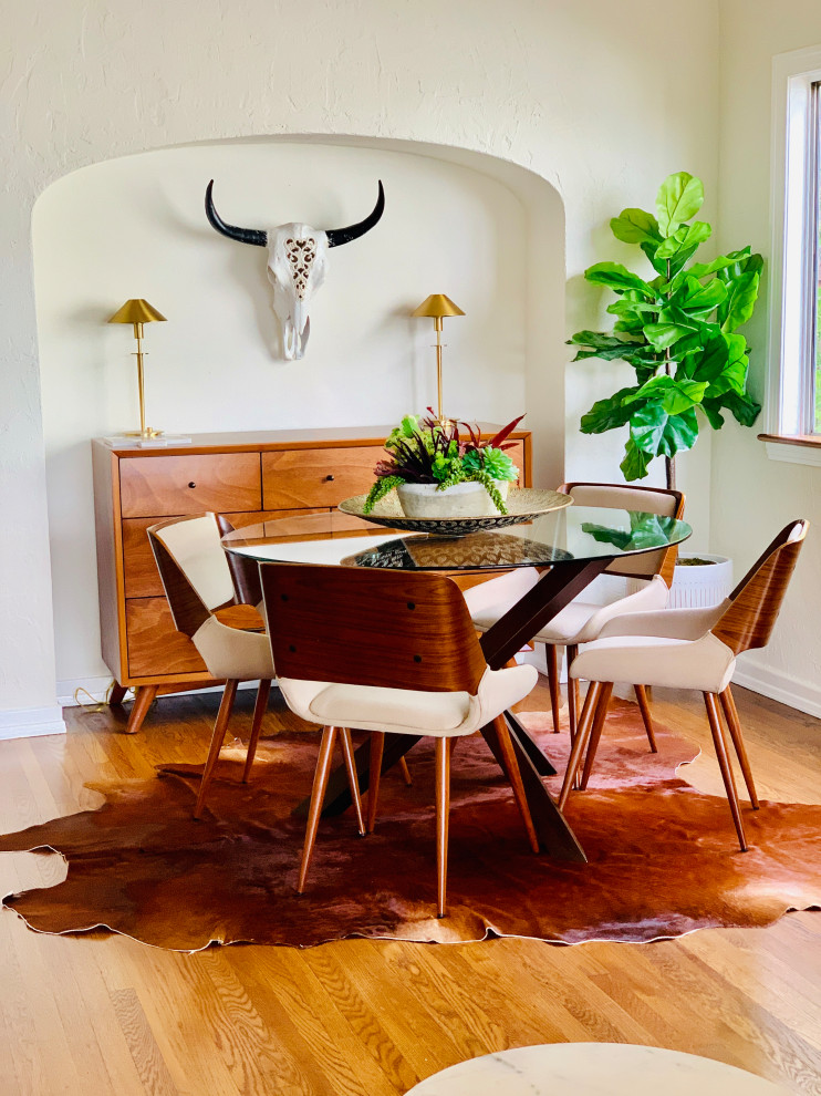 Example of a southwest medium tone wood floor dining room design in Los Angeles with beige walls and no fireplace