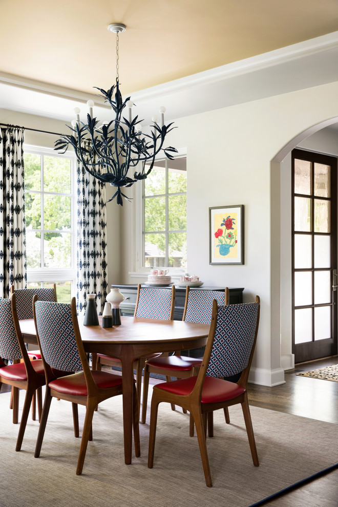 Transitional dark wood floor dining room photo in Minneapolis with white walls