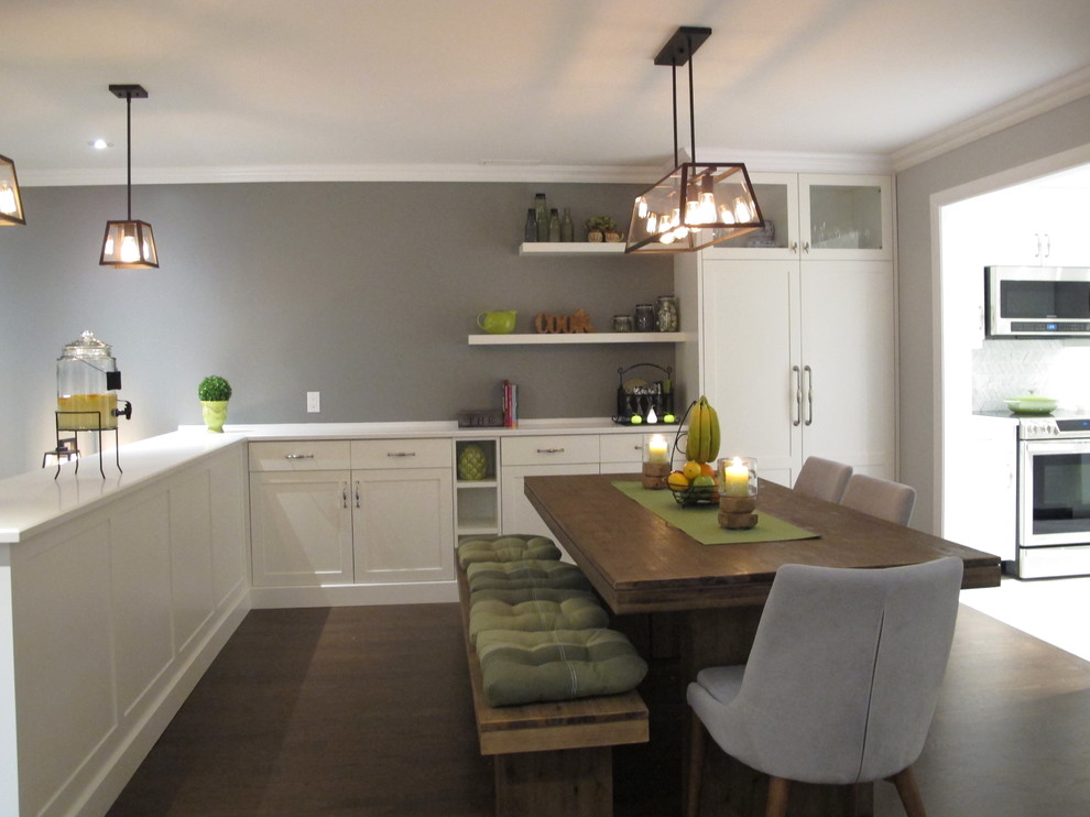 This is an example of a medium sized contemporary kitchen/dining room in Montreal with grey walls, dark hardwood flooring and brown floors.