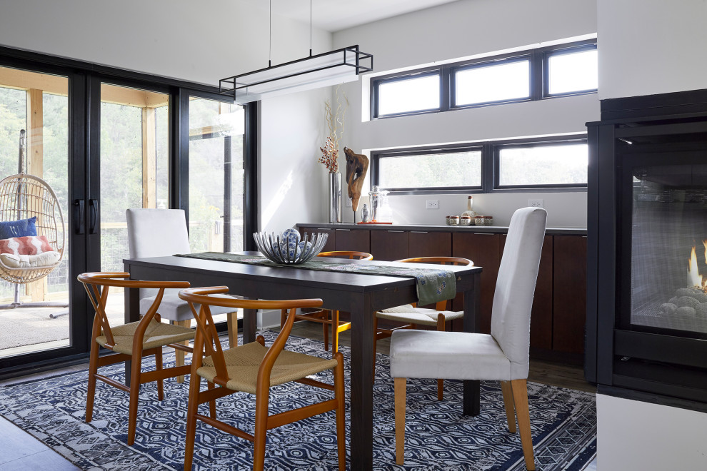 Inspiration for a contemporary dining room in DC Metro with white walls and grey floors.