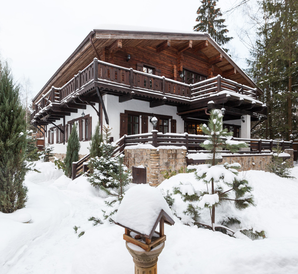 Inspiration for a rustic two-story exterior home remodel in Moscow