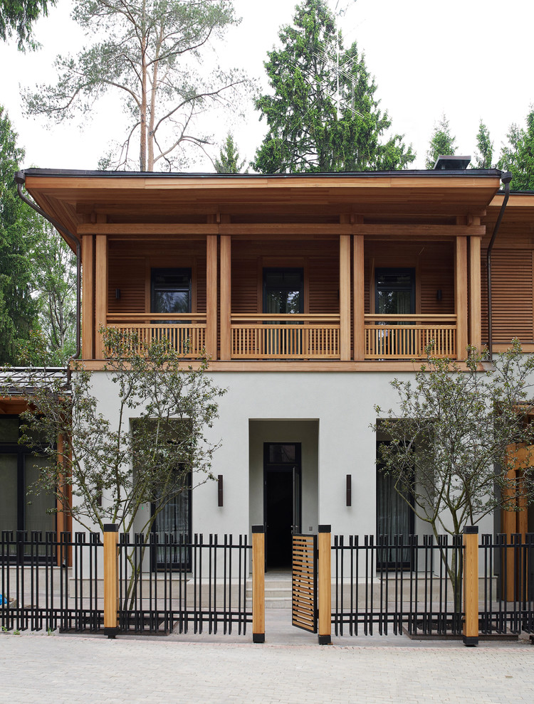 Inspiration for a contemporary white two-story mixed siding exterior home remodel in Moscow