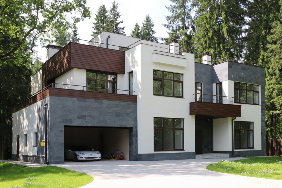 Foto de fachada de casa blanca actual grande de dos plantas con revestimientos combinados, tejado plano y tejado de varios materiales