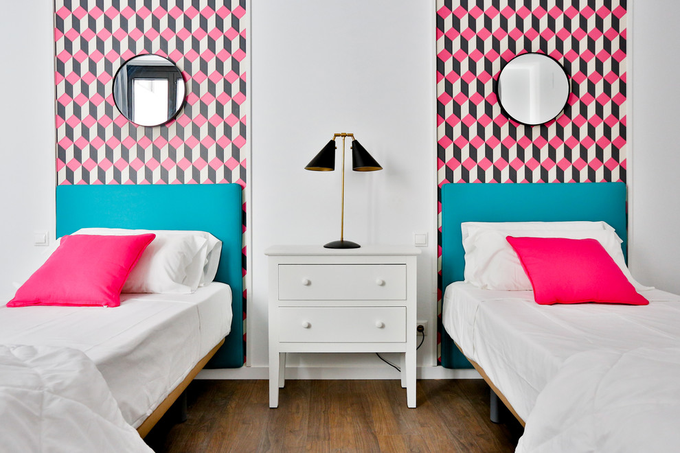 Design ideas for a medium sized contemporary gender neutral teen’s room in Madrid with multi-coloured walls and dark hardwood flooring.