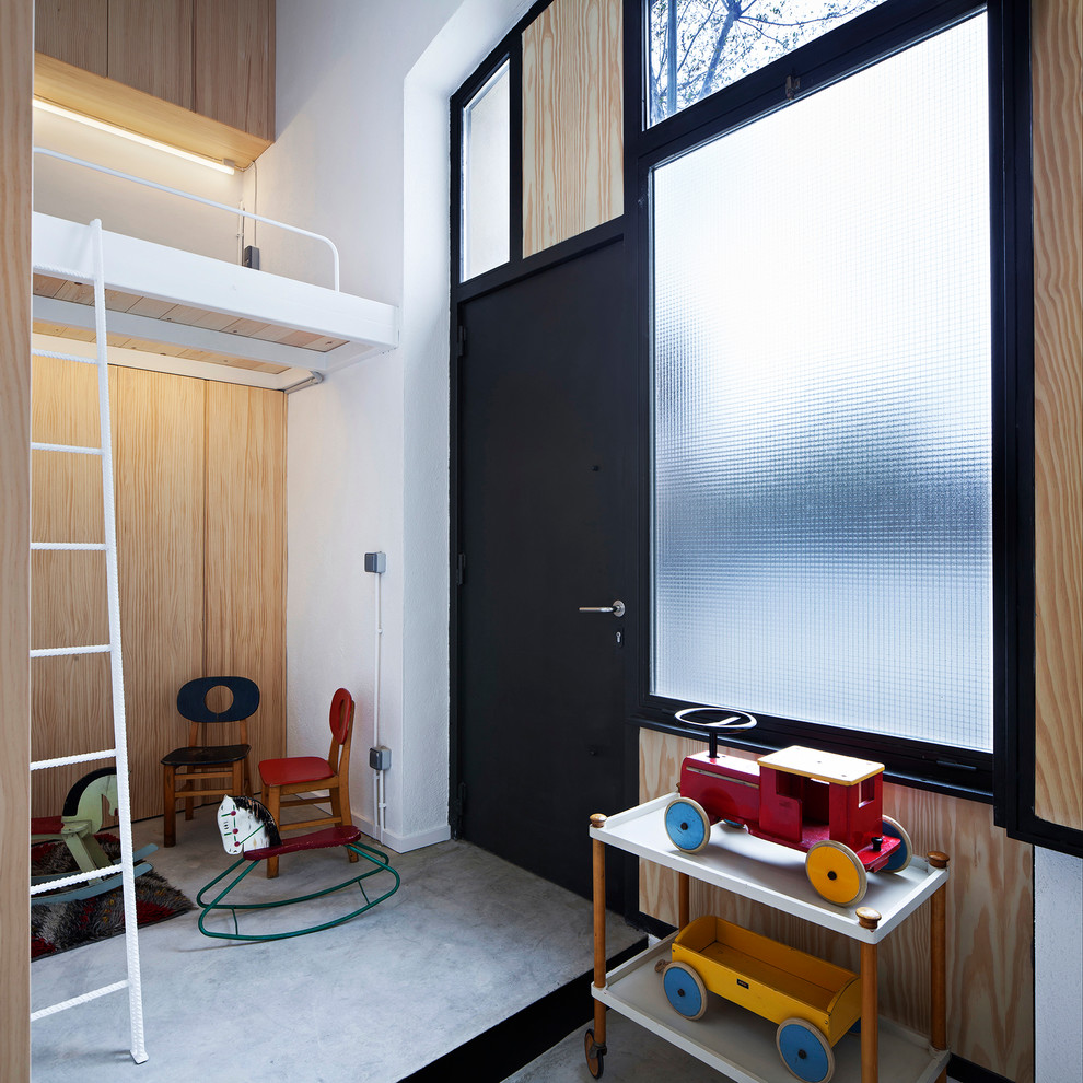 Playroom - small contemporary gender-neutral playroom idea in Barcelona