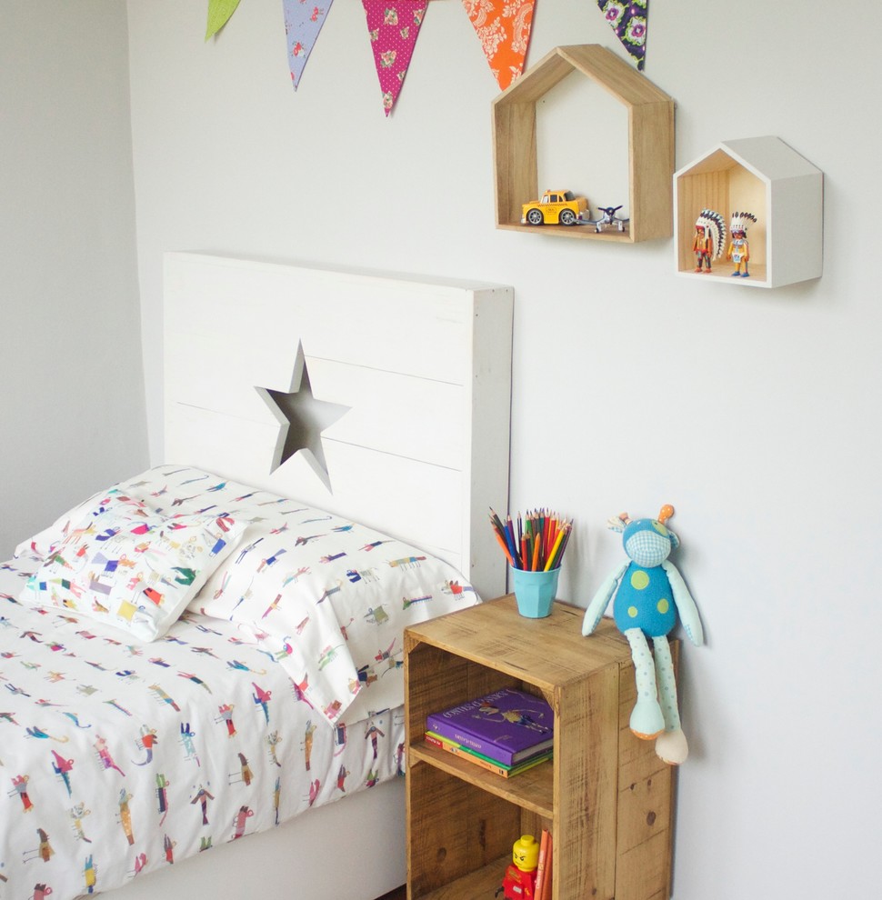 Inspiration for a transitional kids' bedroom remodel in Other with white walls