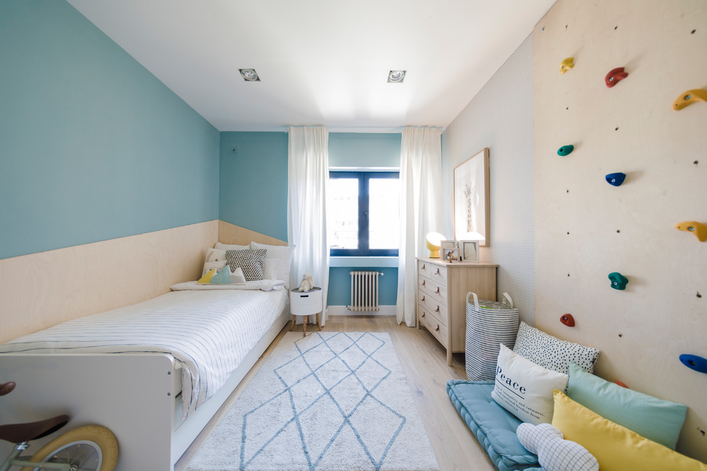Inspiration for a contemporary gender-neutral light wood floor and beige floor kids' room remodel in Other with blue walls