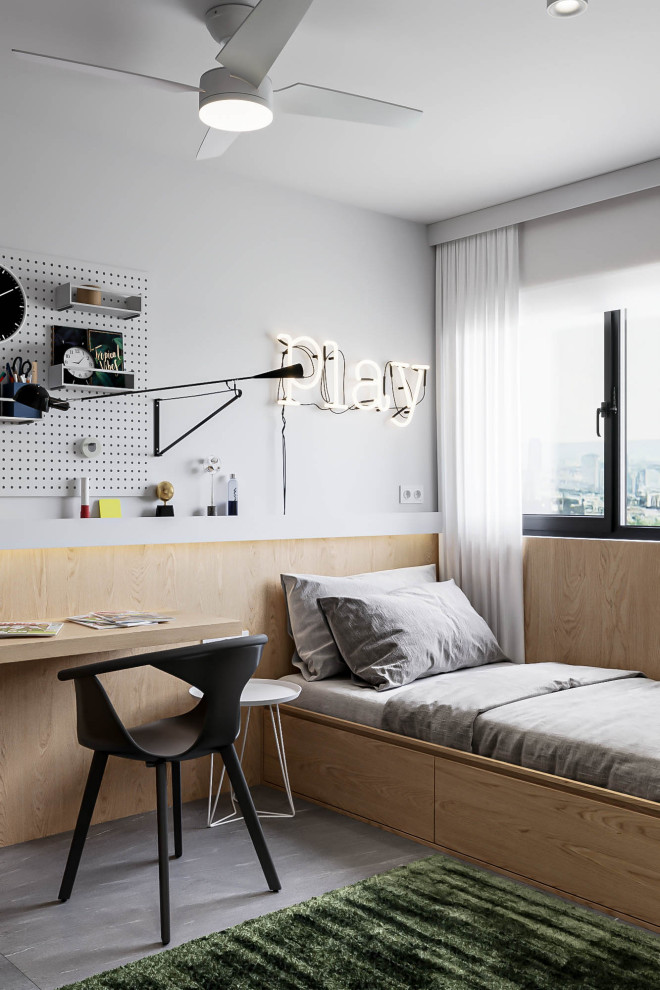 Exempel på ett mellanstort modernt pojkrum kombinerat med sovrum och för 4-10-åringar, med vita väggar, klinkergolv i porslin och grått golv