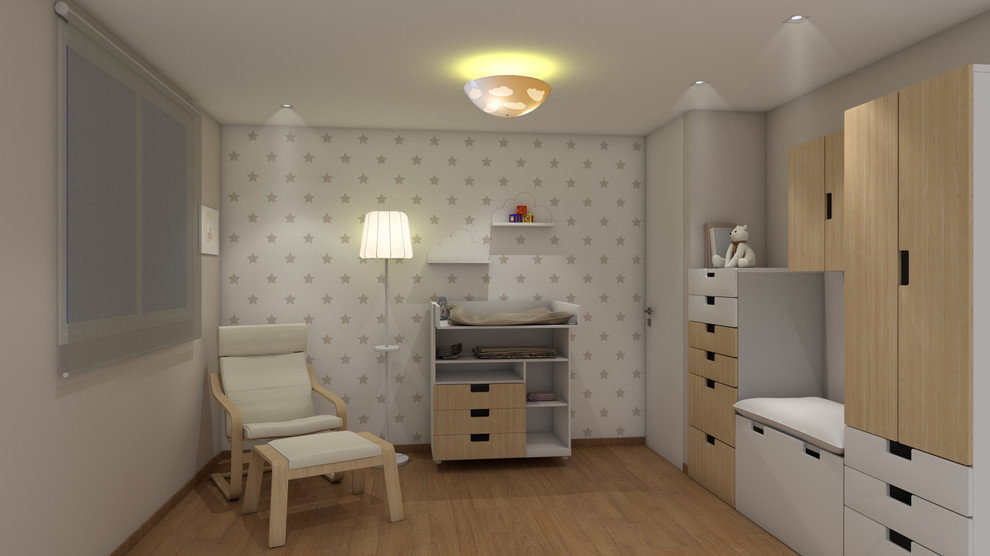 Small scandinavian gender neutral toddler’s room in Other with white walls, medium hardwood flooring and beige floors.