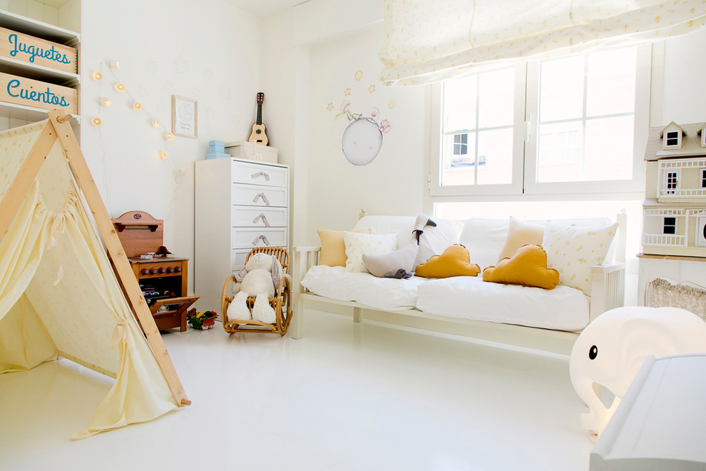 This is an example of a medium sized vintage kids' bedroom for girls in Madrid.
