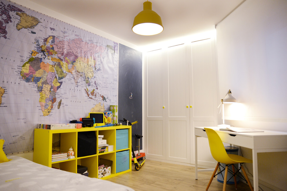 Trendy boy light wood floor and brown floor childrens' room photo in Other with blue walls