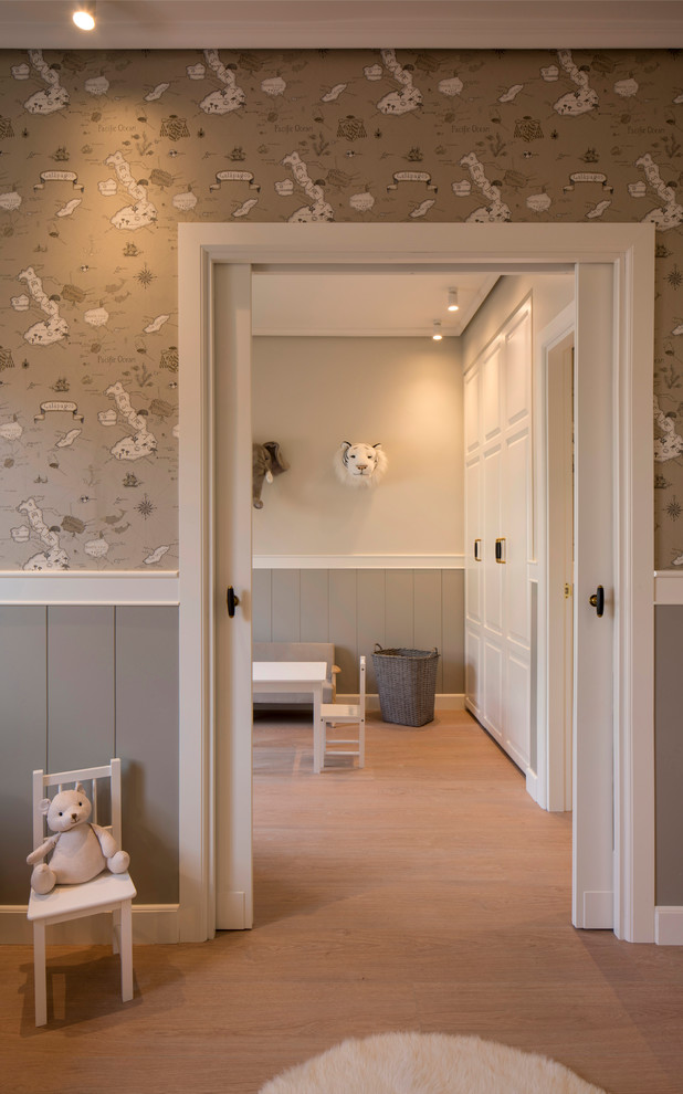 Kids' room - large transitional boy laminate floor kids' room idea in Bilbao with brown walls