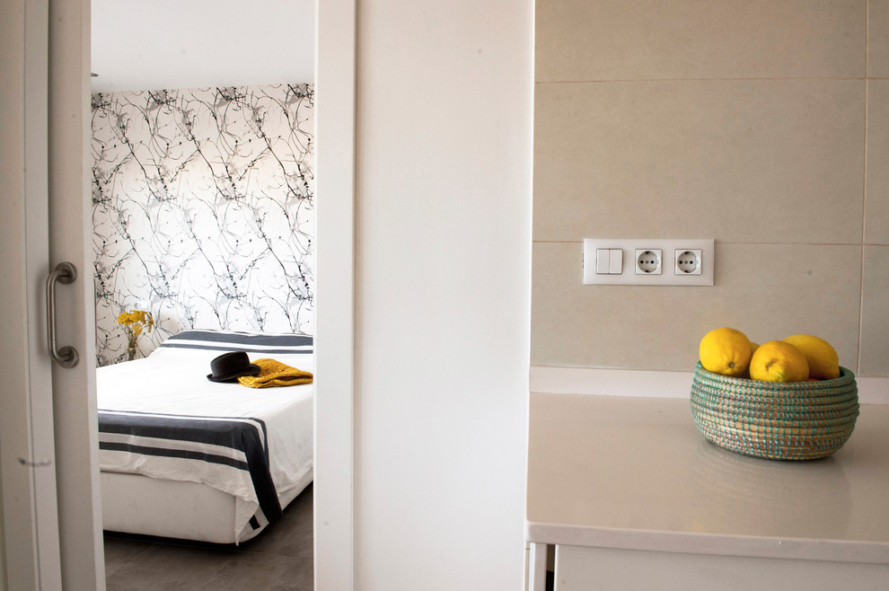 Medium sized contemporary bedroom in Valencia with ceramic flooring.