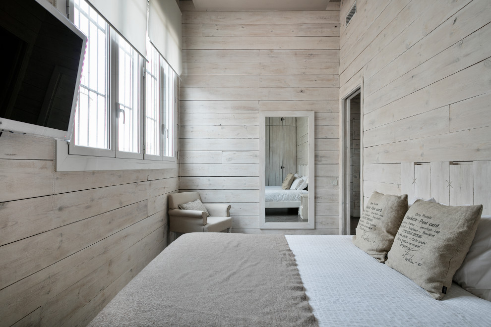 Foto di una camera da letto industriale con pareti beige e nessun camino