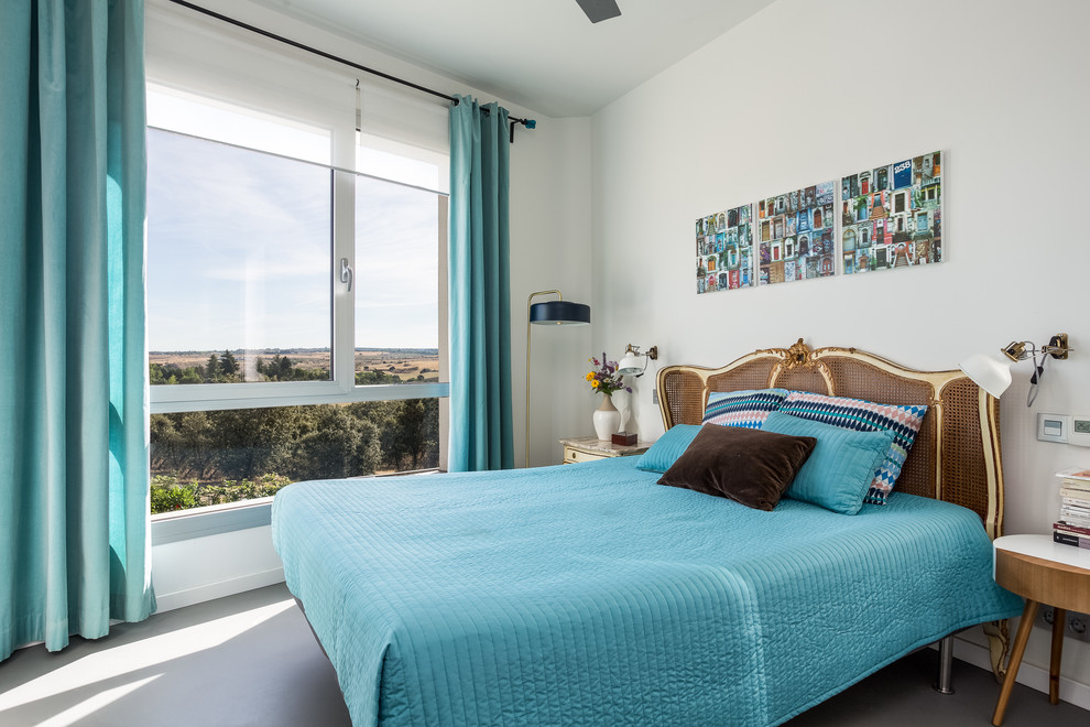 Inspiration for an eclectic guest gray floor bedroom remodel in Madrid with gray walls