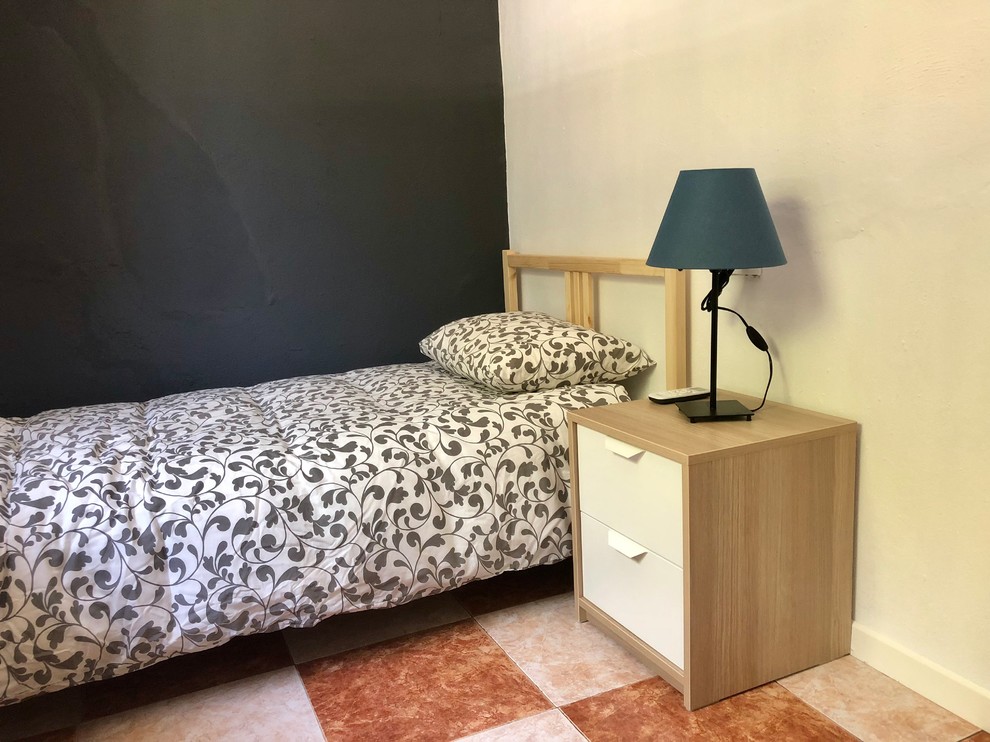 Design ideas for a small traditional master bedroom in Seville with multi-coloured walls, ceramic flooring, no fireplace and multi-coloured floors.