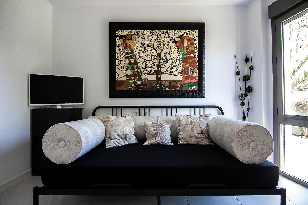 Bedroom - eclectic guest ceramic tile and white floor bedroom idea in Seville with white walls