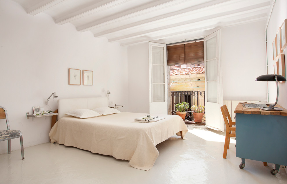 Inspiration for a mid-sized mediterranean master bedroom remodel in Barcelona with white walls and no fireplace