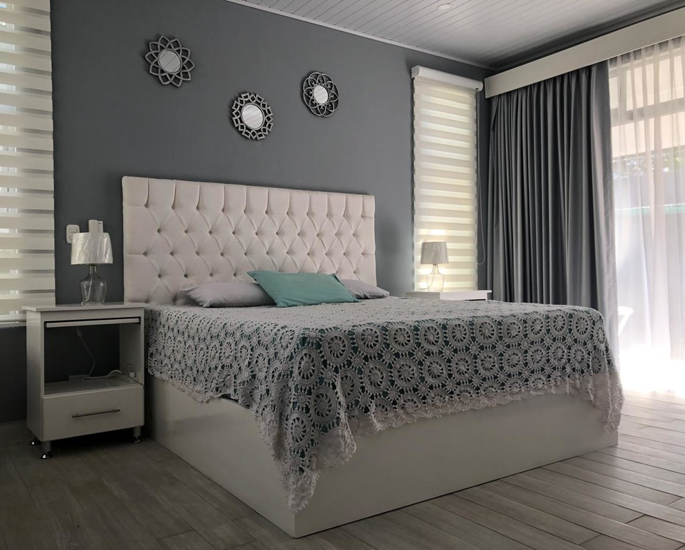 This is an example of a small contemporary master bedroom in Other with grey walls, porcelain flooring and grey floors.
