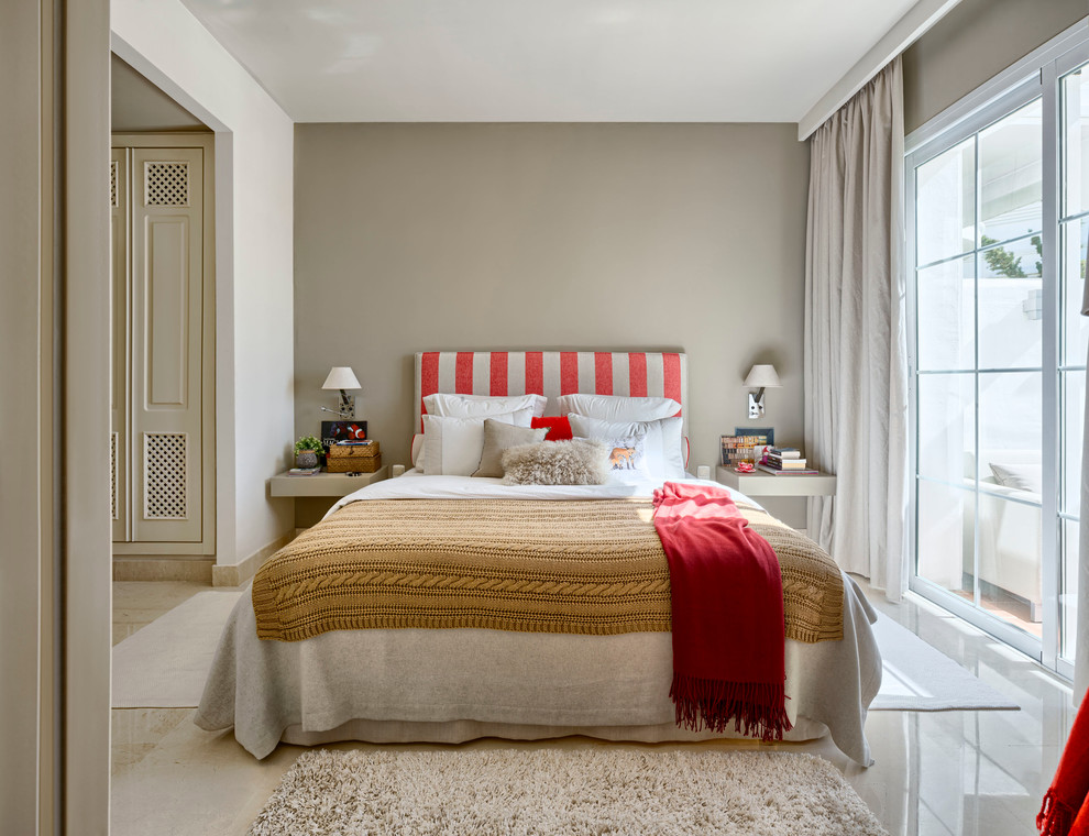 Photo of a medium sized farmhouse master bedroom in Madrid with grey walls, travertine flooring and no fireplace.