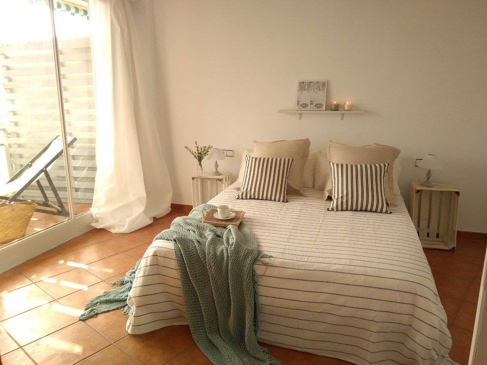 Mid-sized tuscan master ceramic tile bedroom photo in Barcelona with white walls and no fireplace