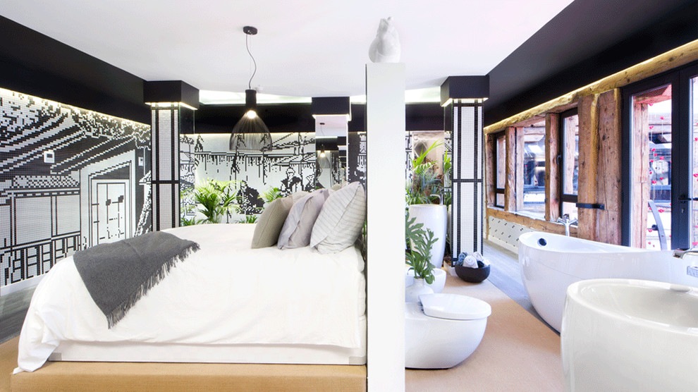 Ejemplo de dormitorio tipo loft de estilo zen extra grande con paredes negras