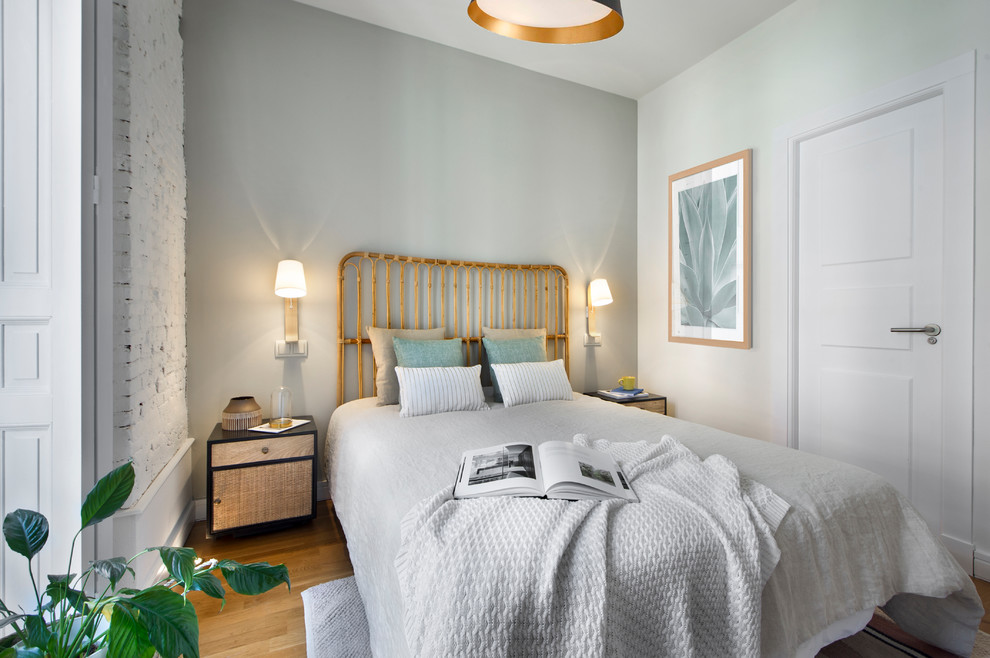 Bedroom - transitional medium tone wood floor and brown floor bedroom idea in Barcelona with gray walls