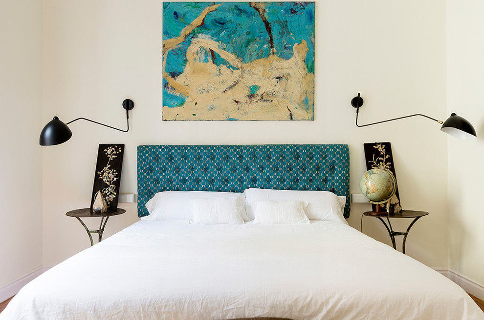 Mid-sized eclectic master bedroom photo in Madrid with white walls and no fireplace