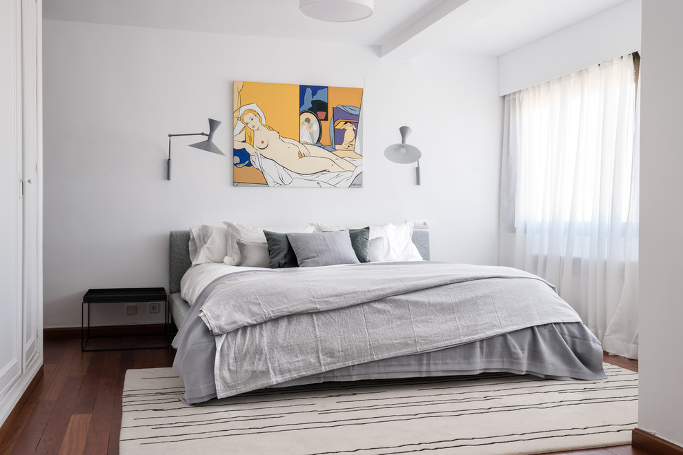 Large danish master dark wood floor and brown floor bedroom photo in Other with white walls