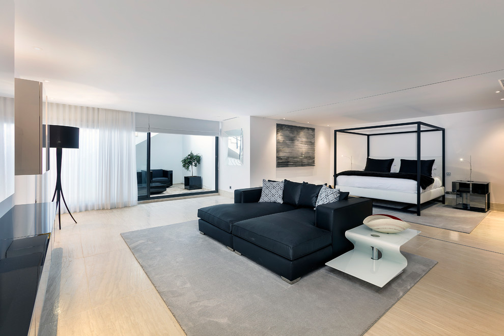 Expansive contemporary master bedroom in Other with white walls.