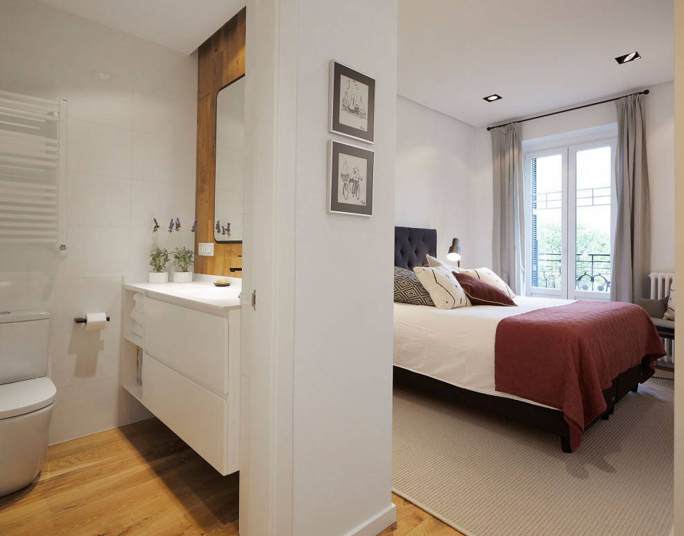Mid-sized trendy master light wood floor and beige floor bedroom photo in Other with white walls
