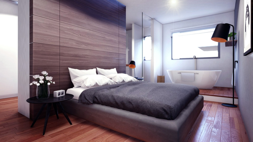 Aménagement d'une chambre parentale contemporaine en bois de taille moyenne avec un mur blanc, sol en stratifié et un sol marron.
