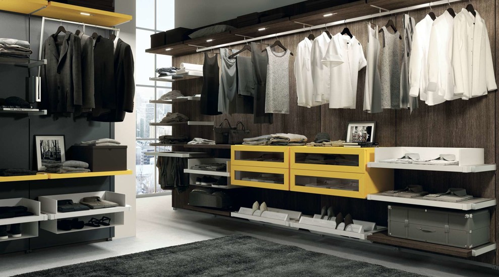 Photo of a medium sized modern dressing room for women in Nice with open cabinets and yellow cabinets.