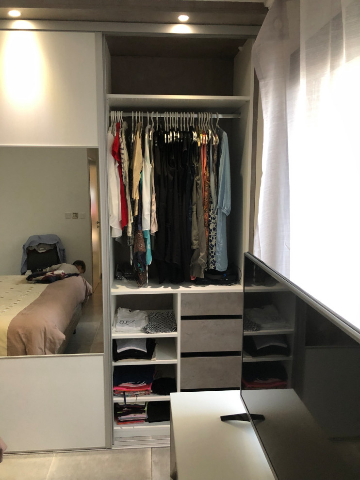 Photo of a large classic gender neutral standard wardrobe in Toulouse with glass-front cabinets and grey cabinets.