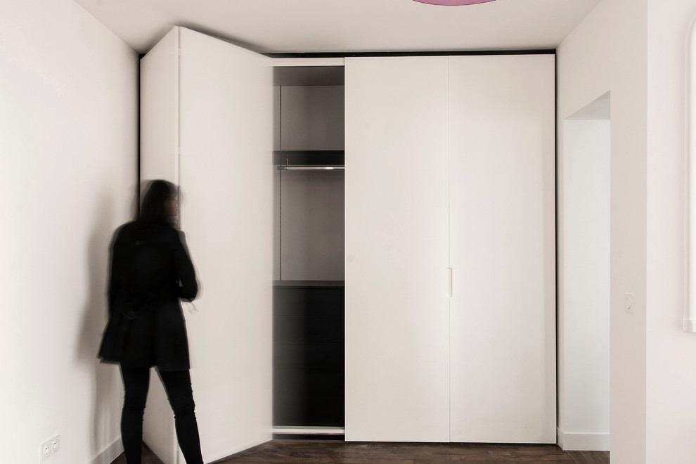 Reach-in closet - mid-sized contemporary gender-neutral reach-in closet idea in Paris
