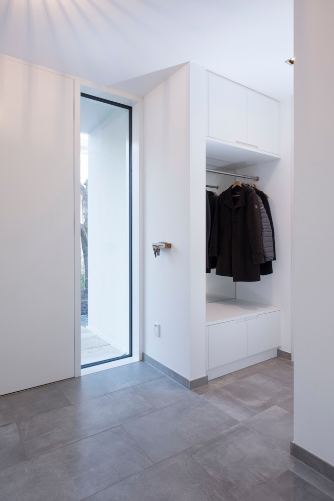Inspiration for a medium sized contemporary front door in Munich with white walls, a double front door and a white front door.
