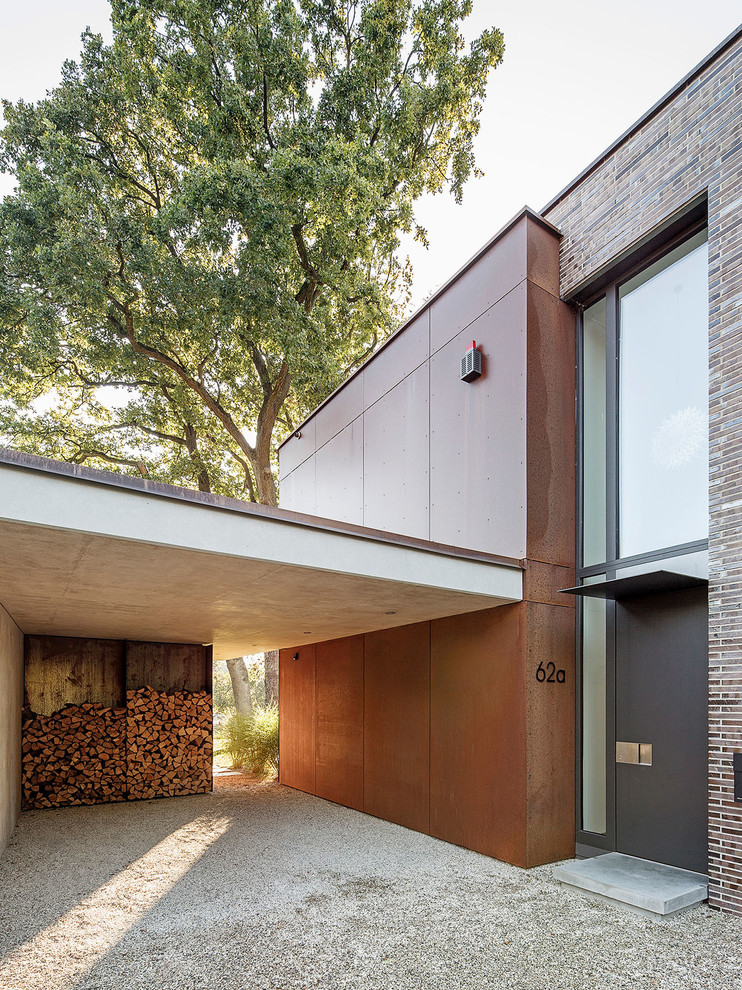 This is an example of a medium sized contemporary entrance in Cologne with brown walls and grey floors.