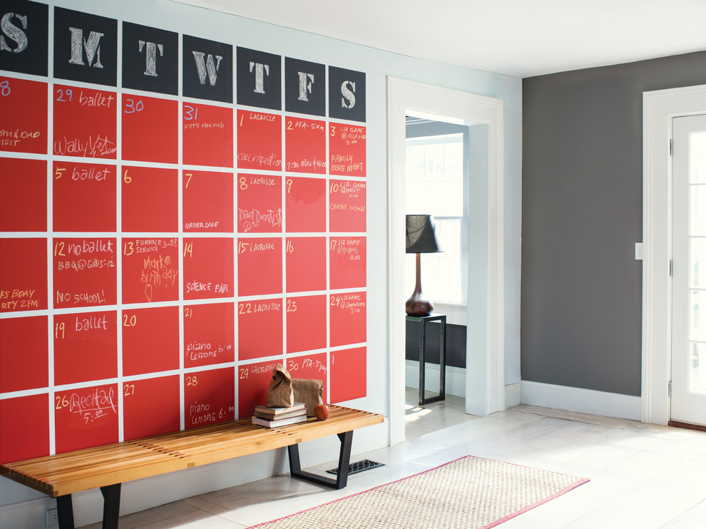 Example of a trendy beige floor entry hall design in Other with gray walls and a white front door