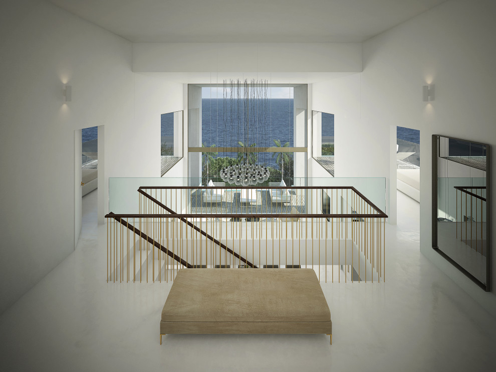マヨルカ島にある高級な広いモダンスタイルのおしゃれな玄関ラウンジ (白い壁、コンクリートの床、グレーの床、折り上げ天井) の写真