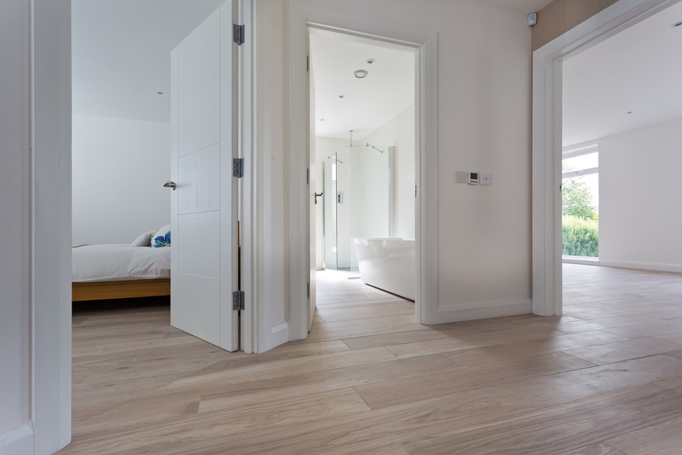 Inspiration for a large scandinavian hallway in Belfast with white walls and porcelain flooring.