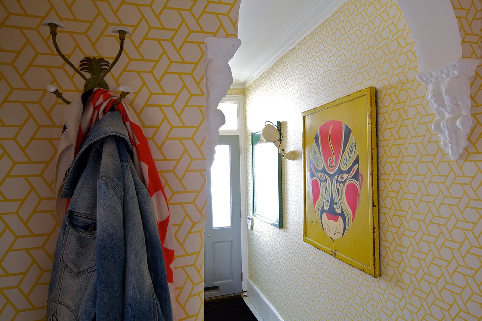 Photo of a bohemian entrance in London with yellow walls.