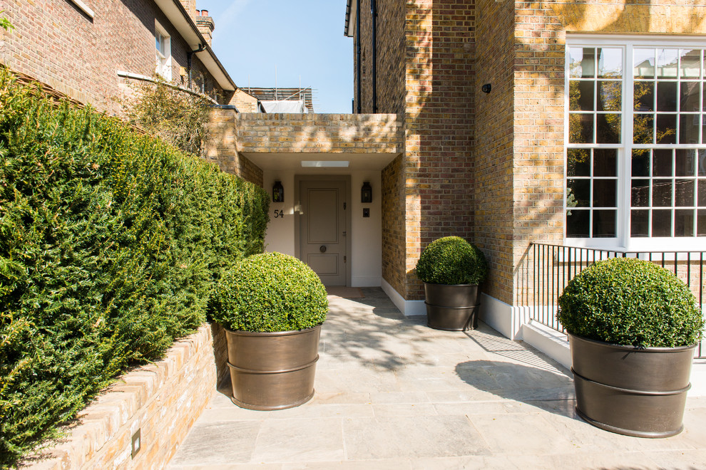 This is an example of a large contemporary front door in London with a single front door.